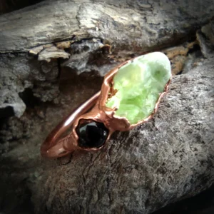 Onyx and peridot ring