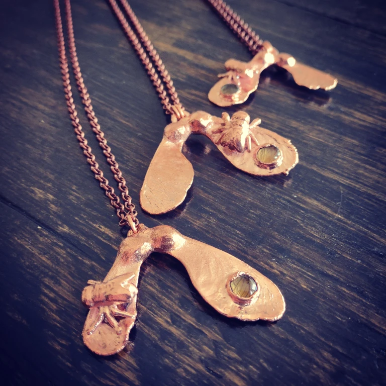 Winged seeds necklace with fly