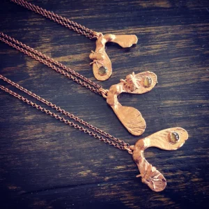Winged seeds necklace with fly